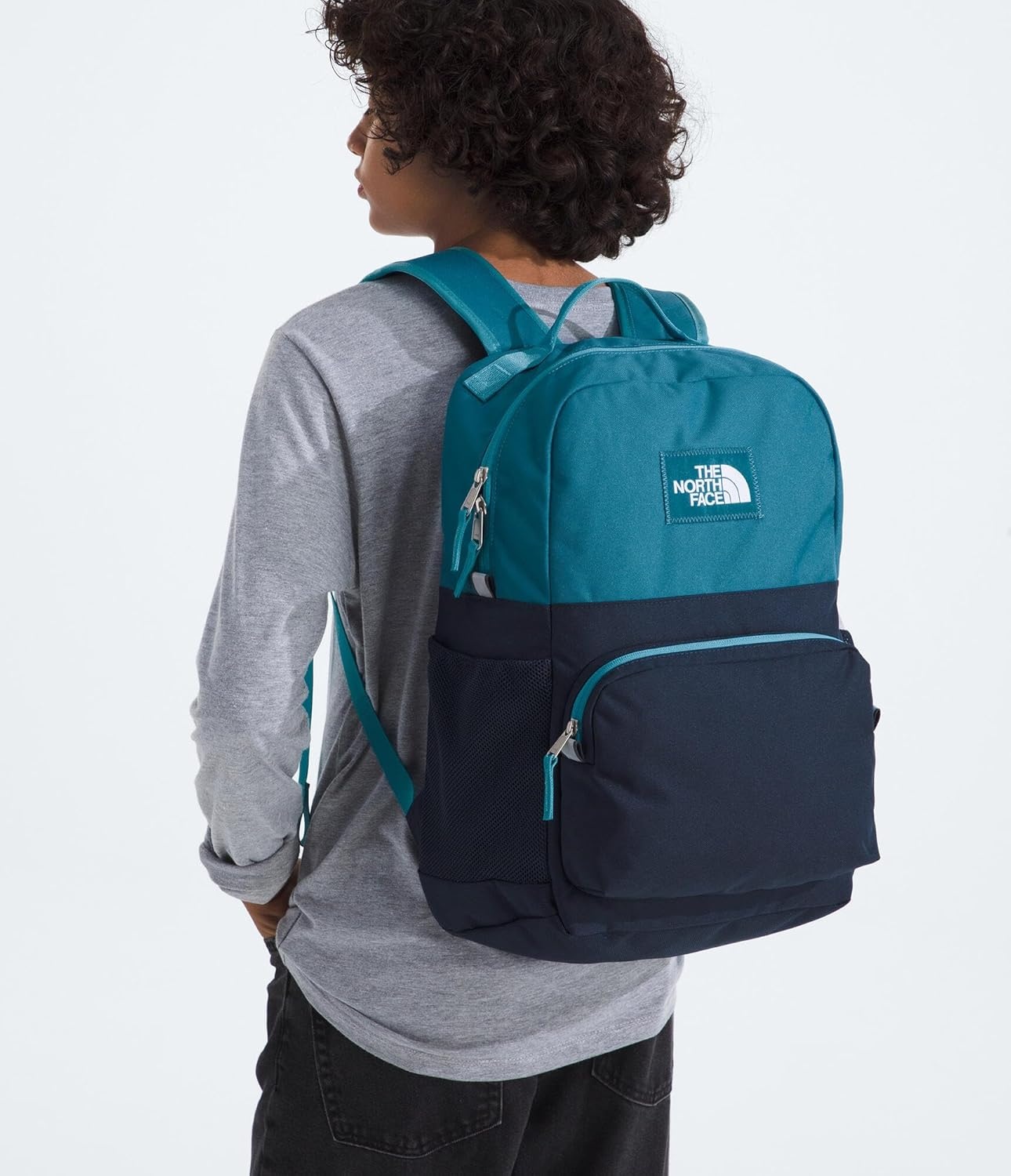 imageTHE NORTH FACE Teen Chuckwalla Daypack Travel Backpack Laptop Sleeve Reflective Safety Details Adjustable Strap Metal PinkTranscendent GreyPale Blossom One SizeDusk BlueSummit Navy